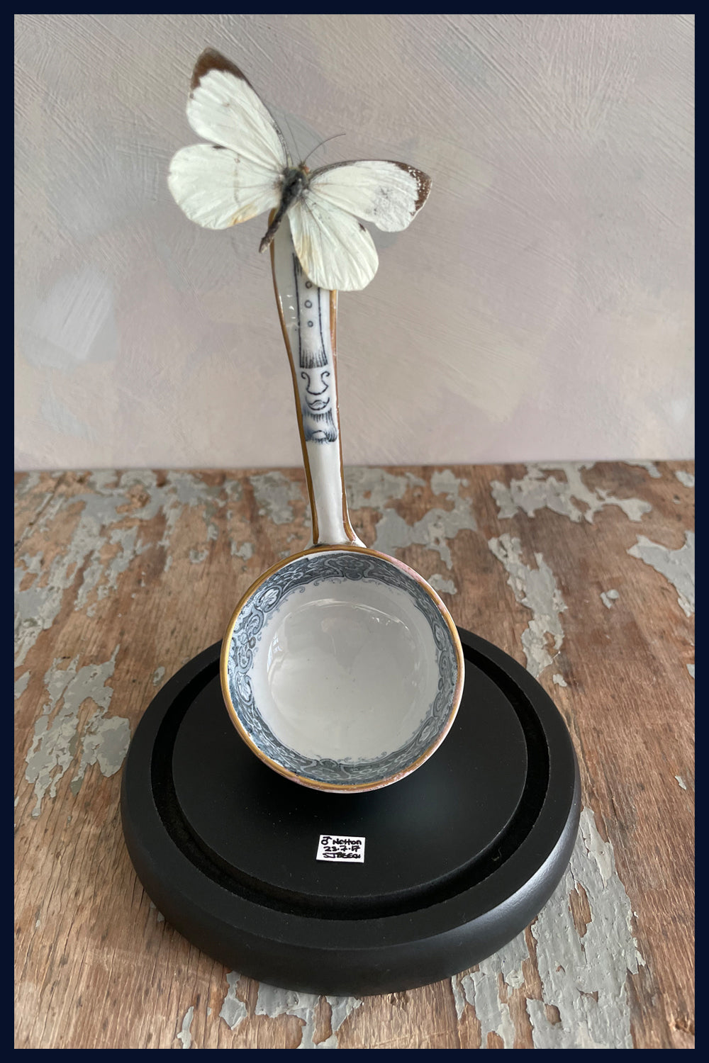 Enigma Variations Collection: Antique China Ladle with a Vintage White Butterfly under a Glass Display Dome