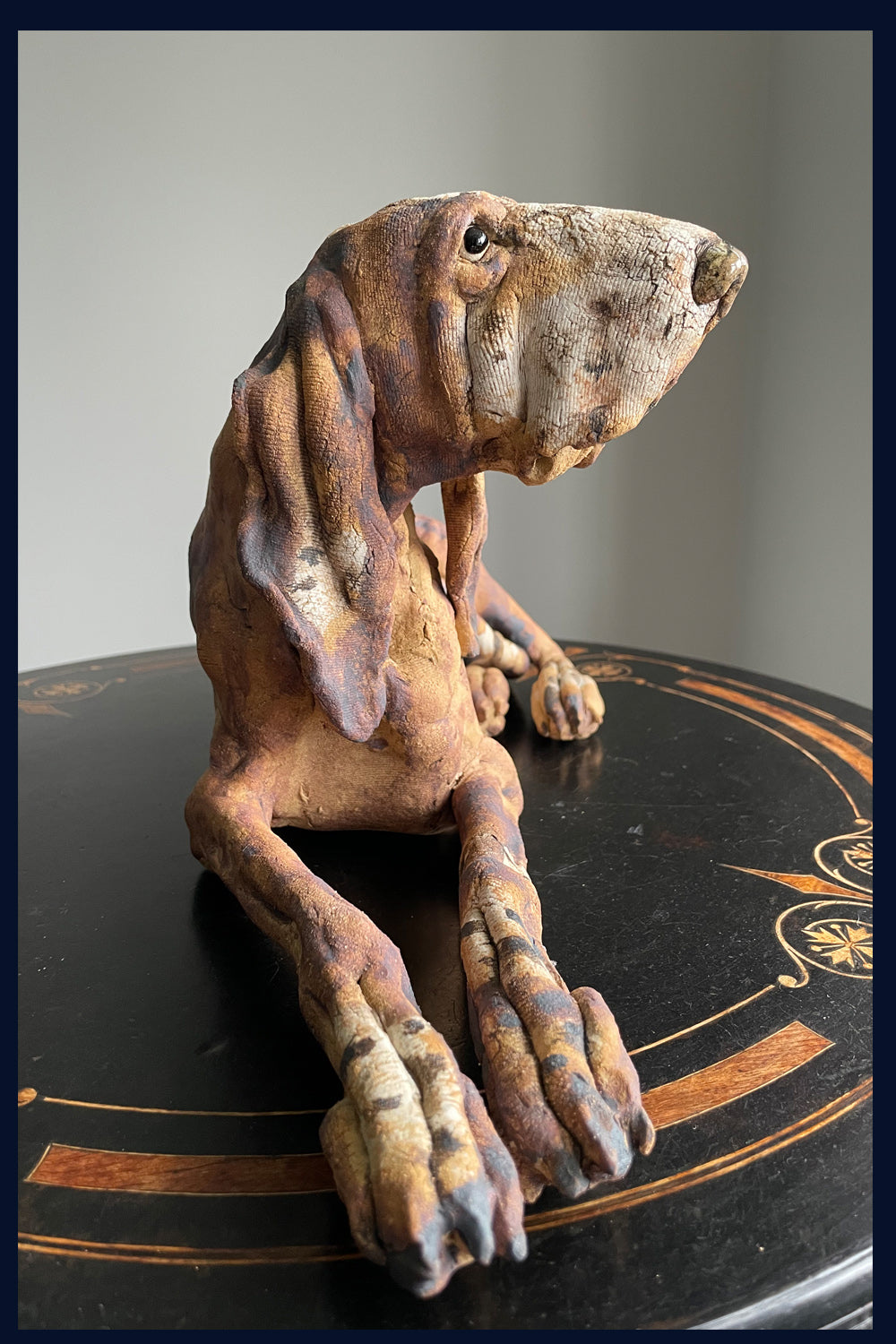 Reclining Hound Dog: Stoneware Sculpture by Elaine Peto