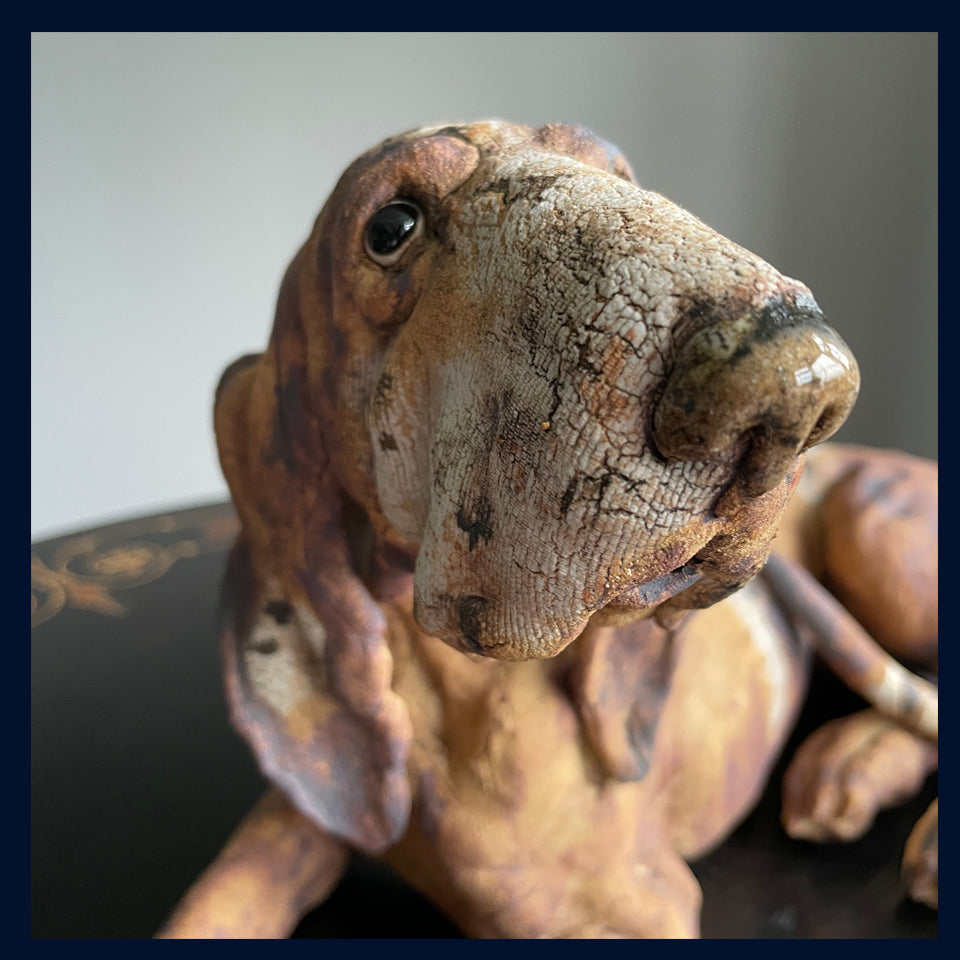 Reclining Hound Dog: Stoneware Sculpture by Elaine Peto