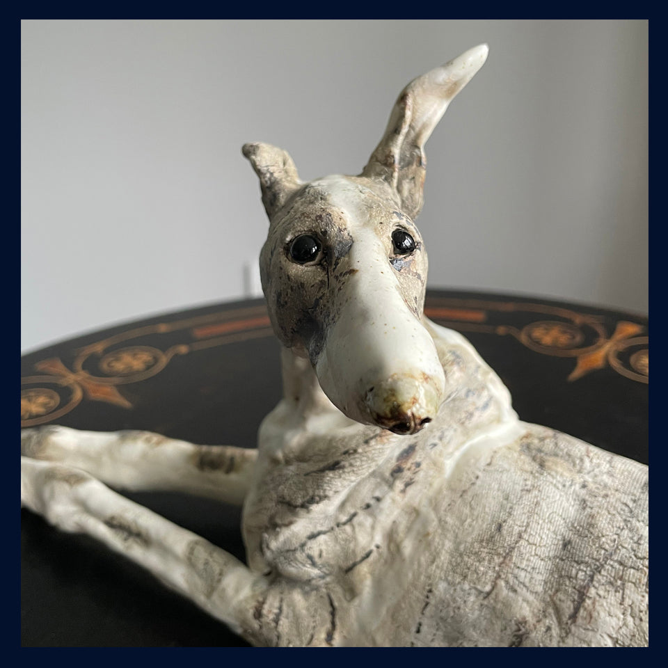 Reclining Lurcher: Stoneware Sculpture by Elaine Peto