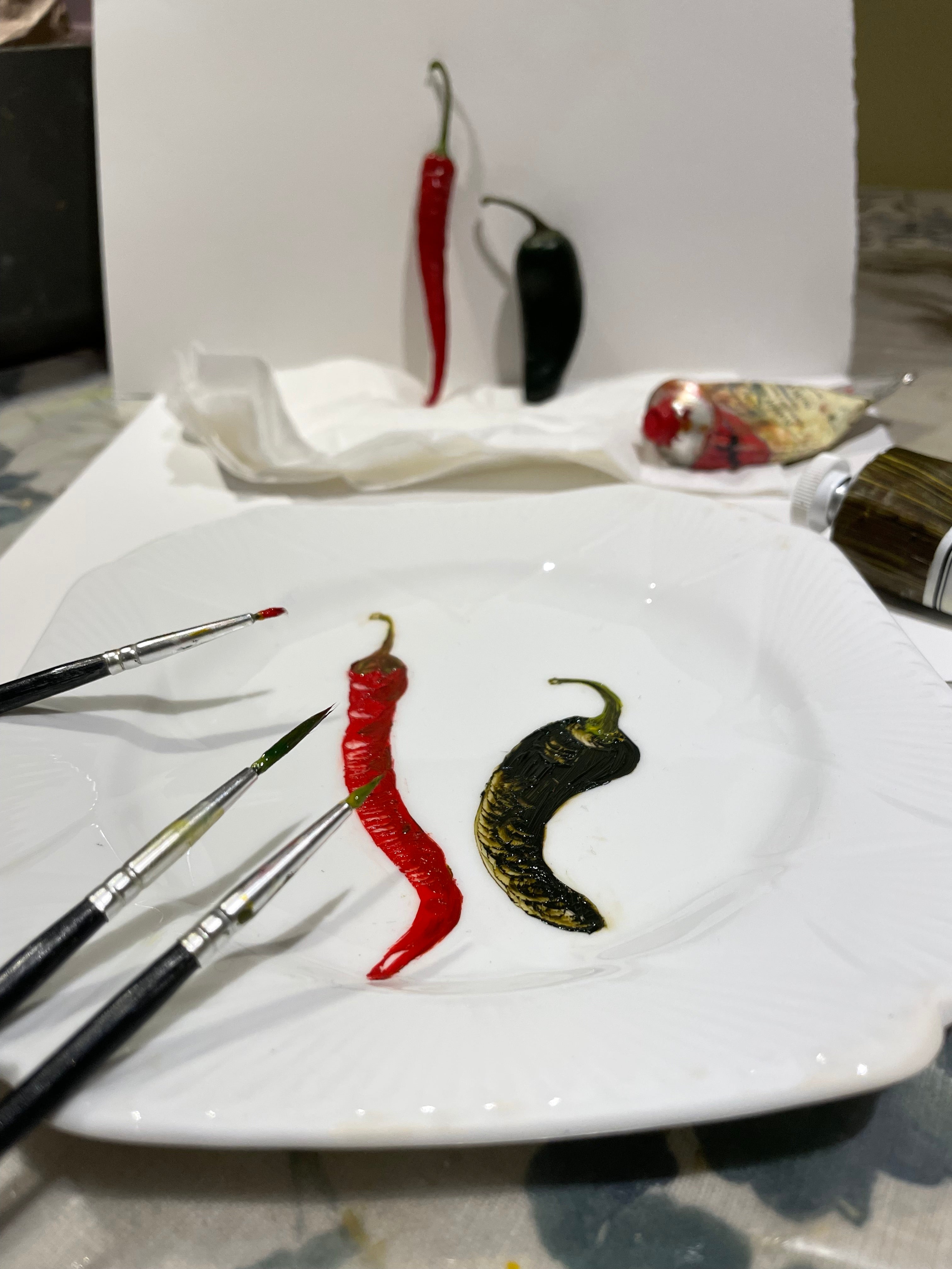 Original oil painting on an antique tea plate - 2 chillies