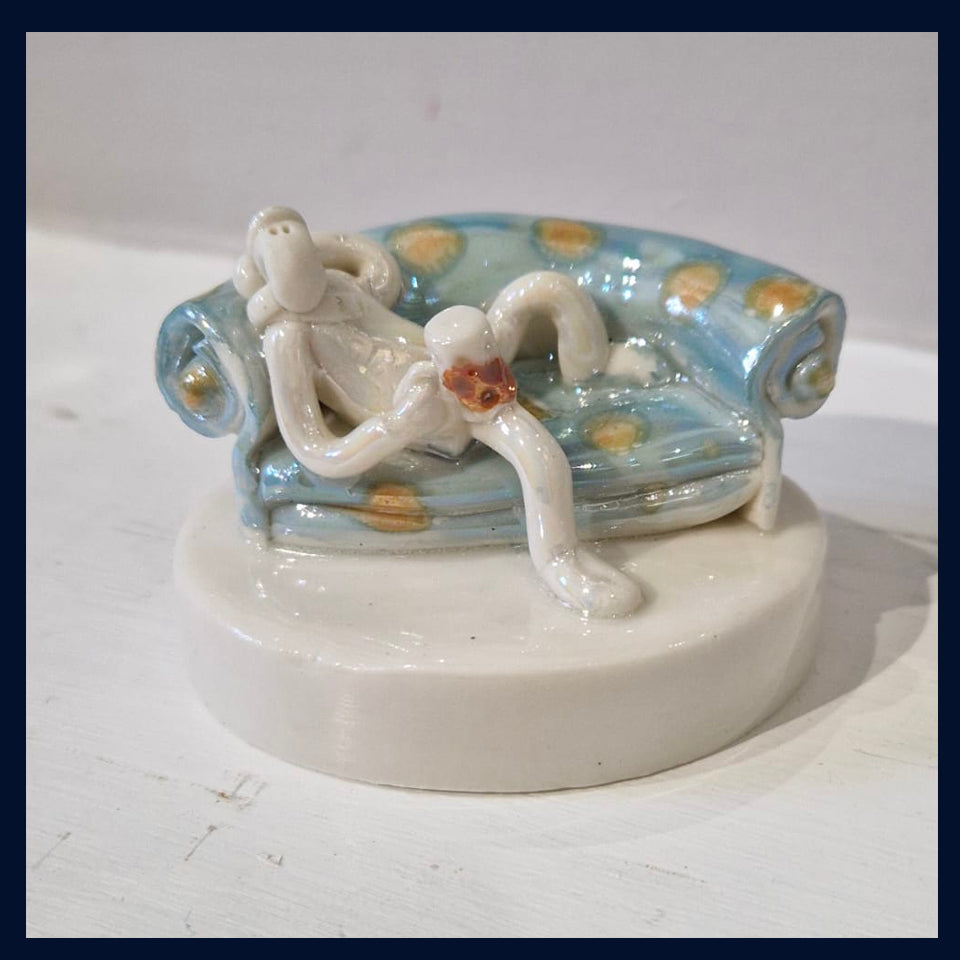 Ceramic Miniaturist Andrew Bull - sofa man with beer