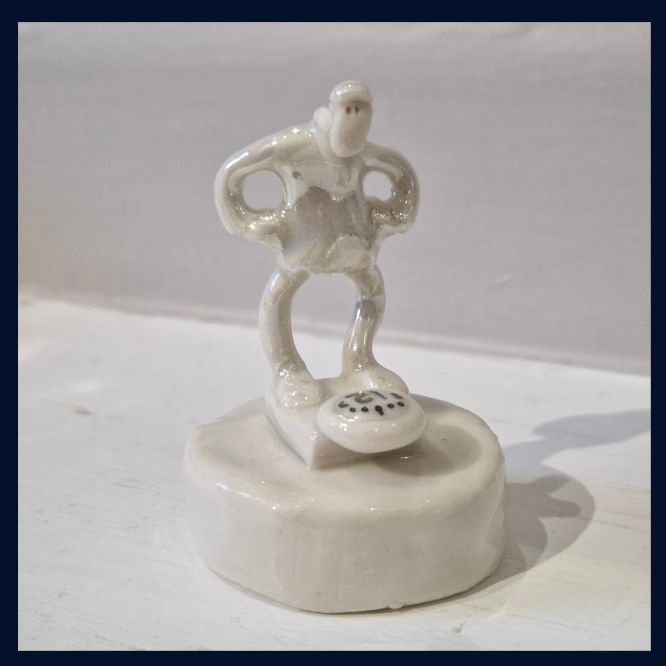 Ceramic Miniaturist Andrew Bull - man weighing himself