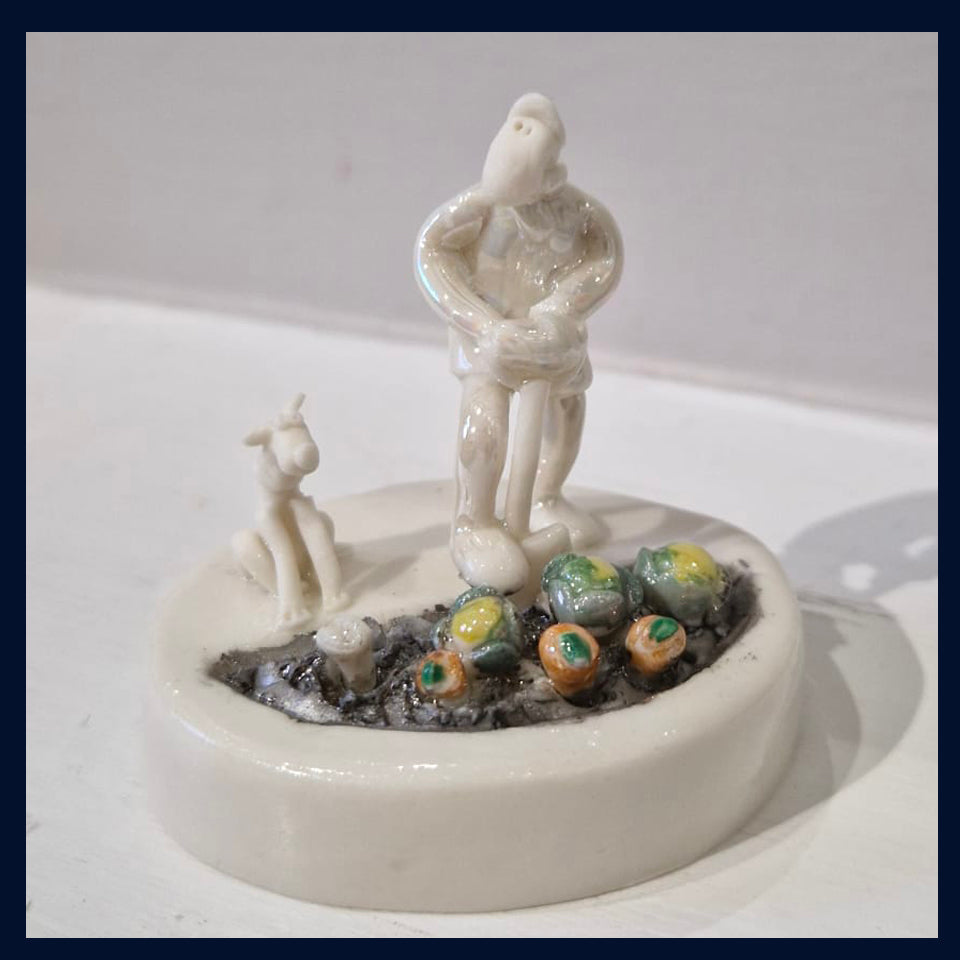 Ceramic Miniaturist Andrew Bull - man digging with a dog