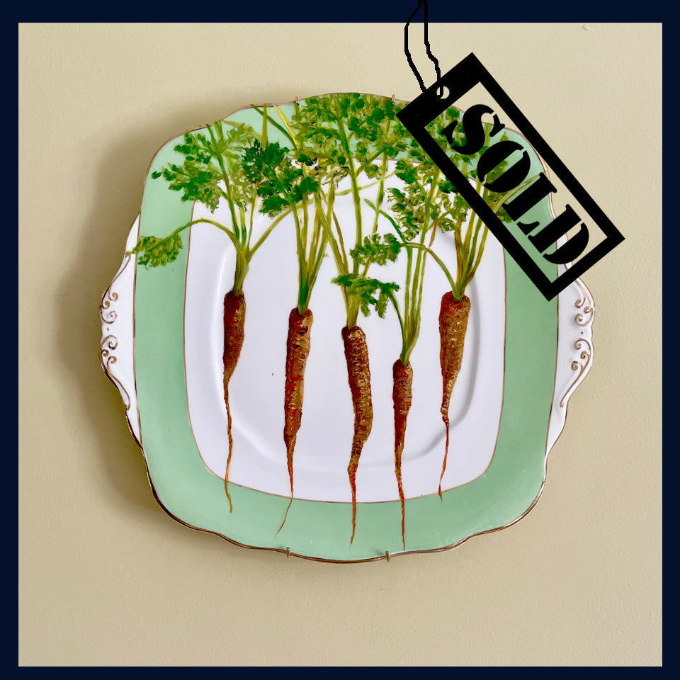 SOLD Original oil painting on a vintage cake plate- carrot thinings from the garden