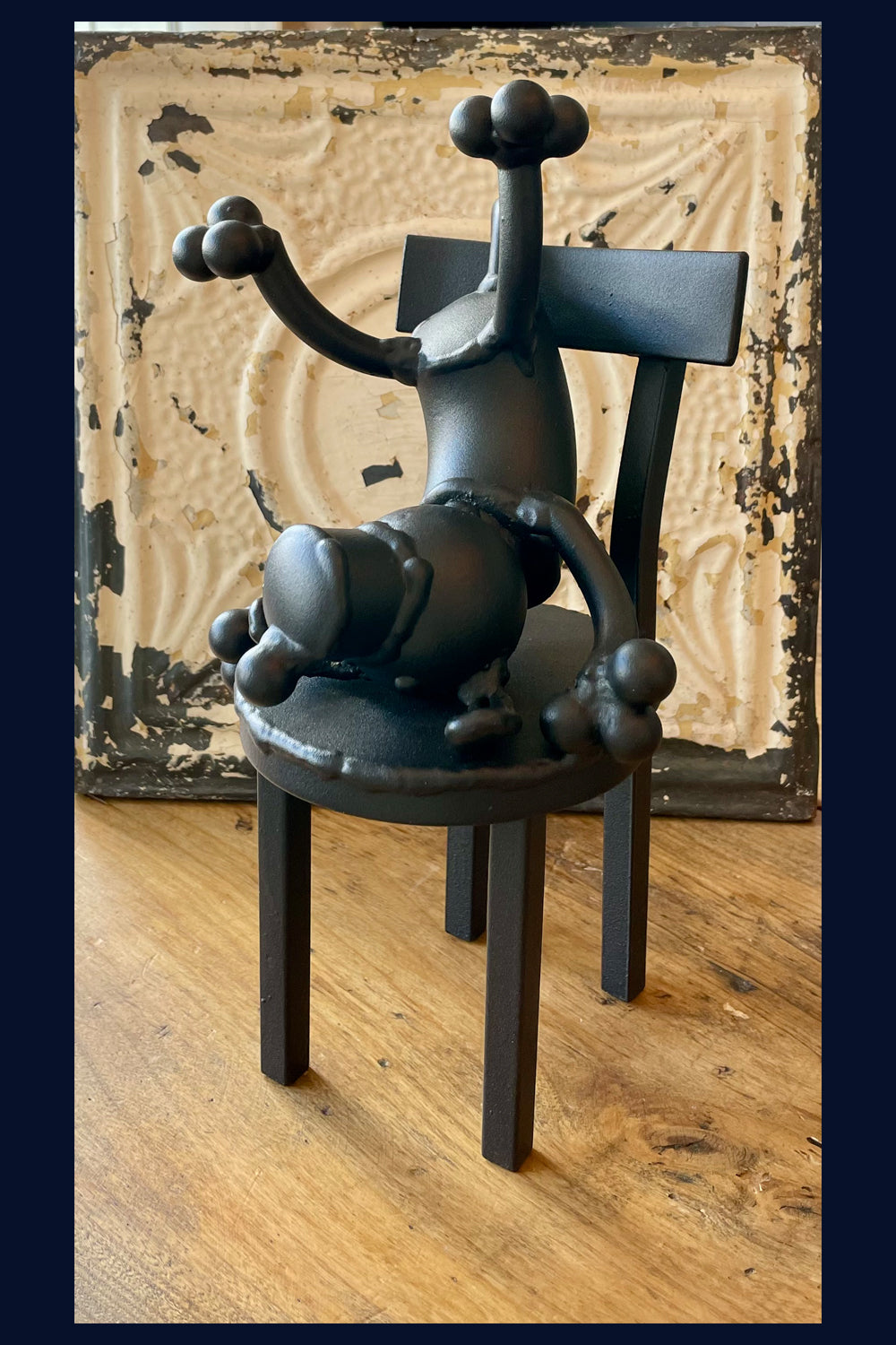 Dog on Chair Contemplating Sculpture by Mick Kirkby-Geddes