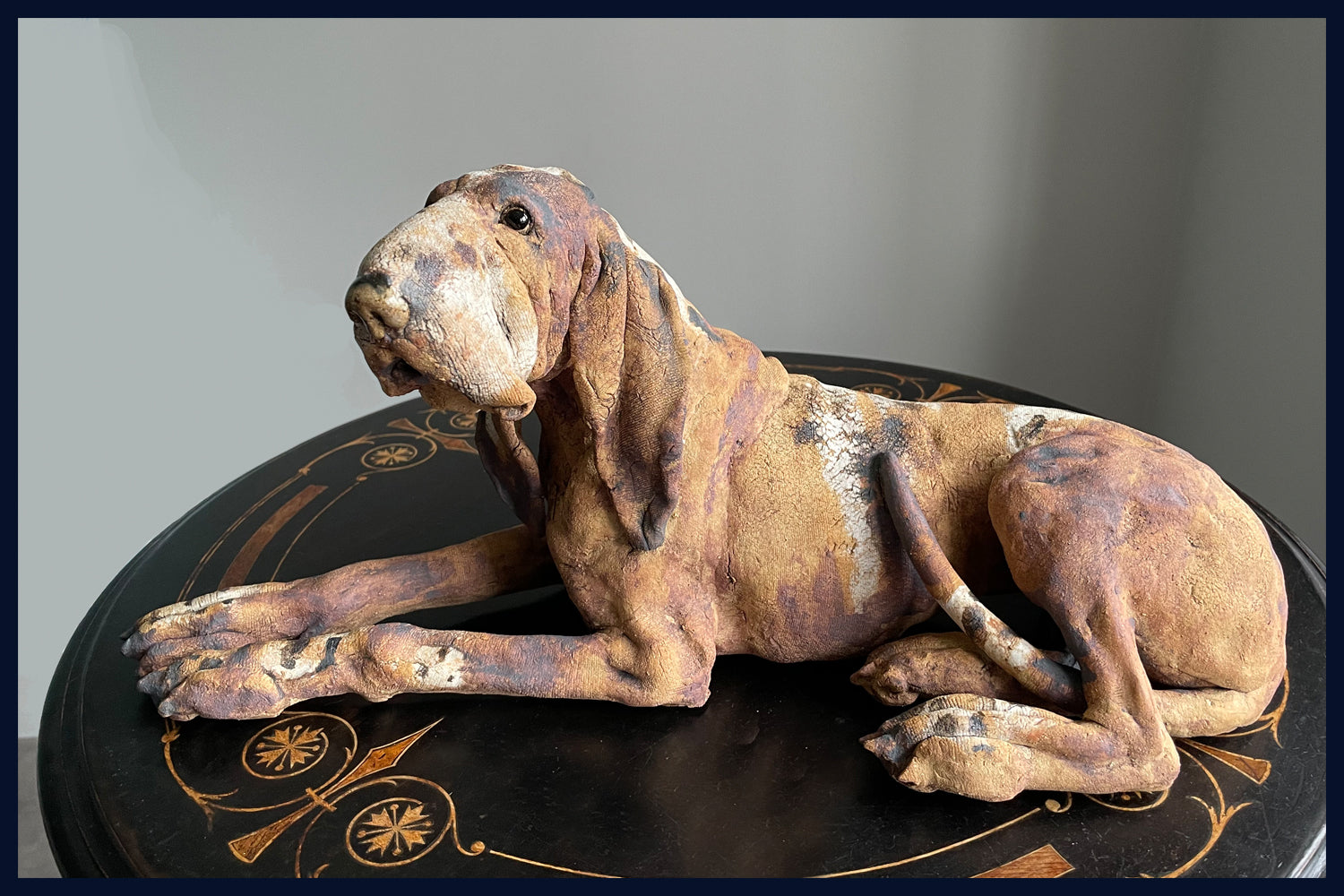 Reclining Hound Dog: Stoneware Sculpture by Elaine Peto