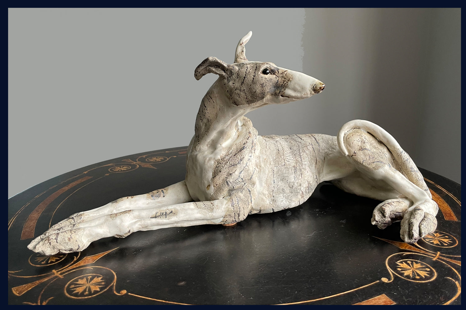Reclining Lurcher: Stoneware Sculpture by Elaine Peto