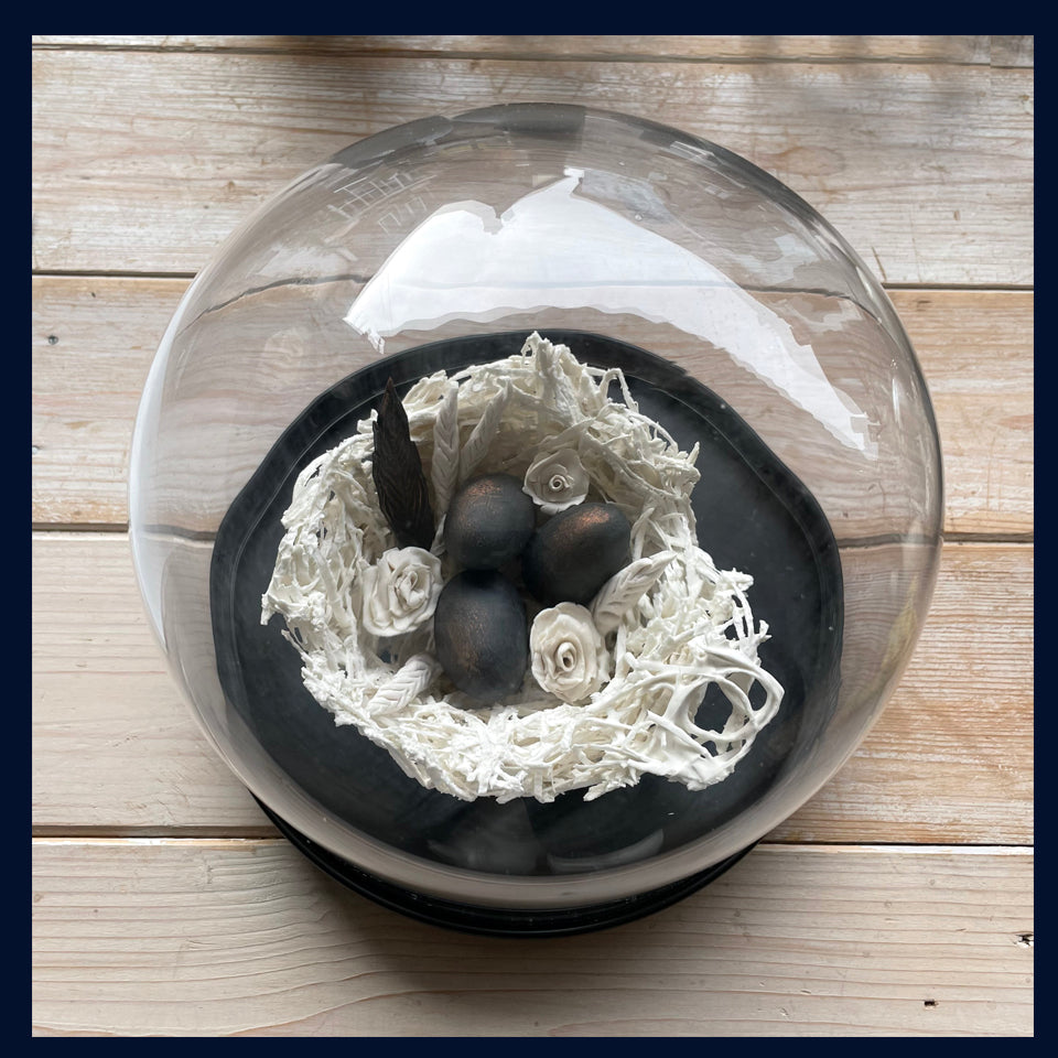 Large Ceramic Nest with Black Eggs and Feathers Under Glass Dome: Ceramic Sculpture by Jillian Riley